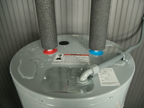 To more easily identify where a leak is coming from, dry up any drips using paper towels.