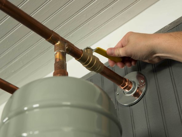 Turn OFF the cold water valve that supplies the water heater.