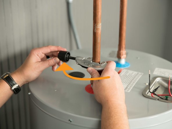 Disconnect the cold and hot water pipes attached to the old water heater. Many are connected with  a threaded union that can be disconnected with wrenches.
