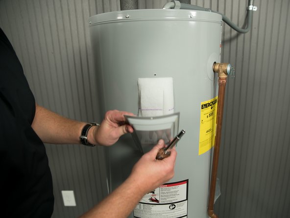 Replace the heating element cover.