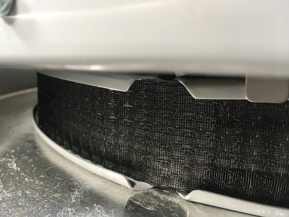 Connect the end points of the filter sections together to form one long section. Wrap this section around the base of the water heater and join at the closest connection point to fit your water heater. If your water heater has a small diameter tank, it may be necessary to use both inner connection points.