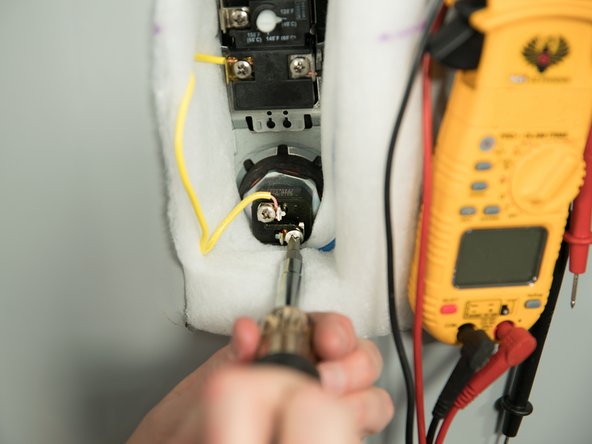 Remove the two power wires from the upper heating element.