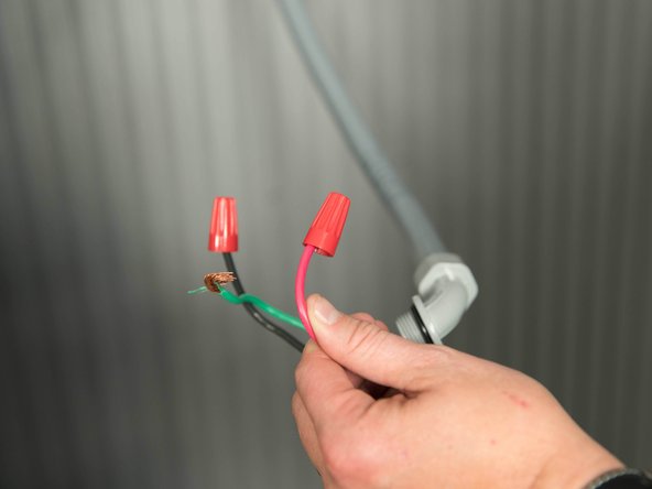Cap the home's power wires with wire nuts.