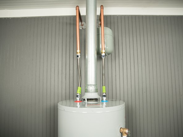 CAUTION! The vent pipe maybe hot. Use caution when removing the insulation from the water pipes.