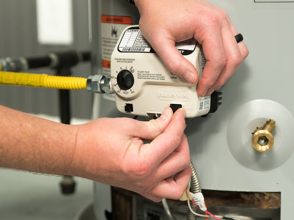 Carefully remove the black connector on the gas control valve. (Do not pull wires!)