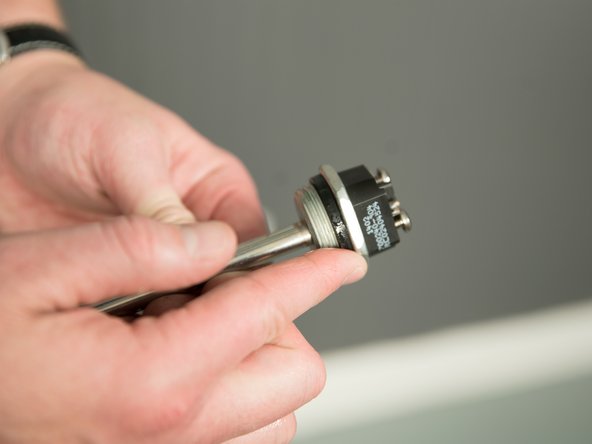 Use a drop of hand dish-washing liquid to lubricate the gasket to help avoid damaging the gasket as it is being tightened.