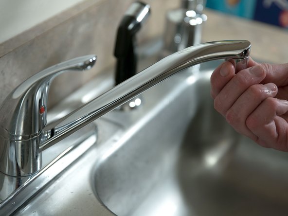 After all of the air has been removed from the tank, close the hot water faucet and replace the aerator.
