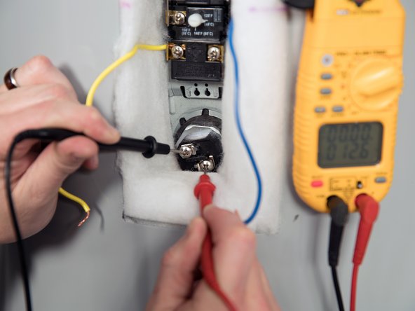 Measure the resistance between the two screw terminals on the heating element.