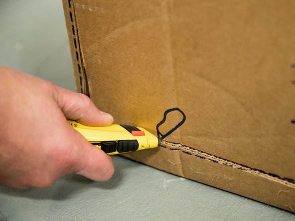 Cut the water heater box along the dotted lines.