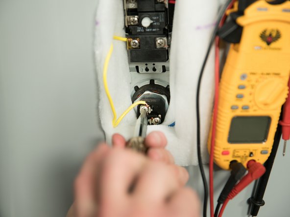 With the tank drained and power off, remove the power wires from  the element you intend to replace.