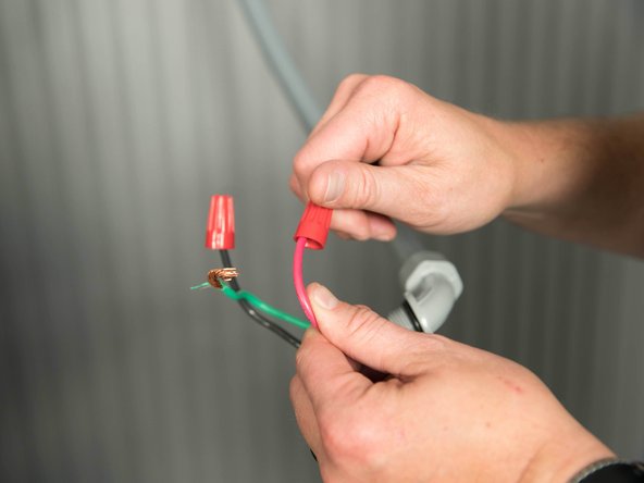 Cap the home's power wires with wire nuts.