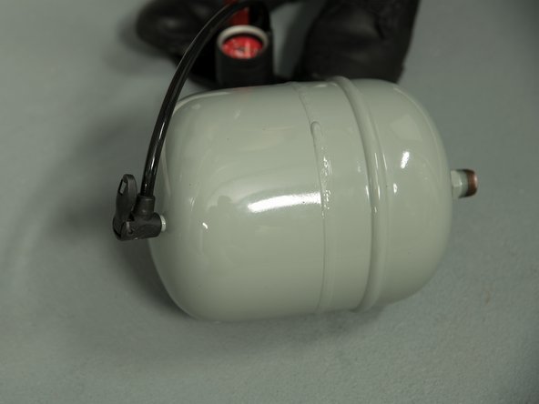 Make all necessary adjustments to the expansion tank's air pressure before installing the expansion tank.