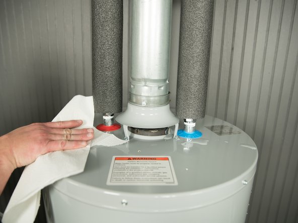 To more easily identify where a leak is coming from, dry up any drips using paper towels.