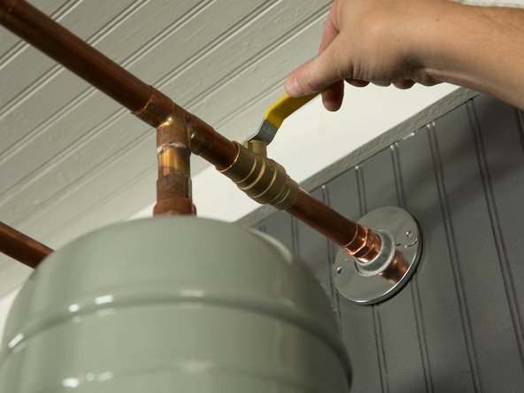 Once the tank has been drained, turn the cold water supply back ON and flush the tank until the water runs clear.