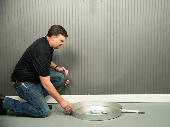 The drain pan must be at least two inches wider than the diameter of the water heater.