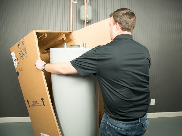 Cut the water heater box along the dotted lines.