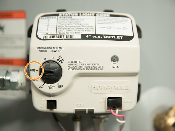 Set the thermostat on the water heater to "HOT" which is approximately 120°F degrees.