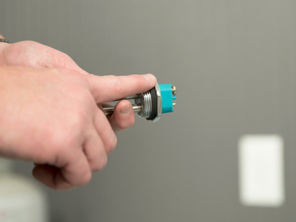 Use a drop of hand dish-washing liquid to lubricate the gasket to help avoid damaging the gasket as it is being tightened.