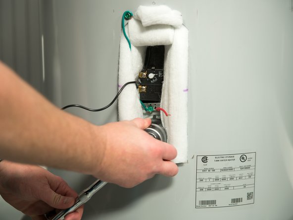 Tighten with an element wrench or 1 1/2&quot; deep well socket.