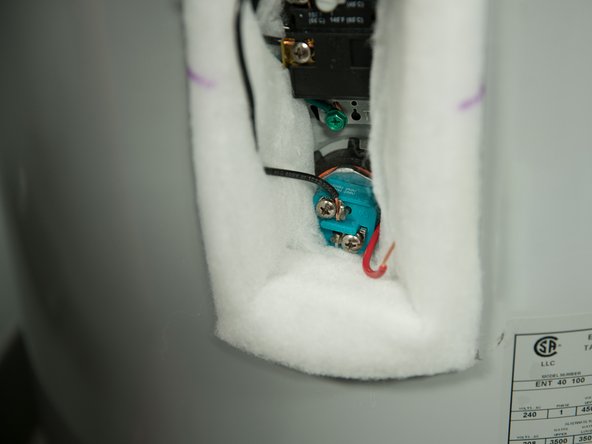 With the tank drained and power off, remove the power wires from  the element you intend to replace.