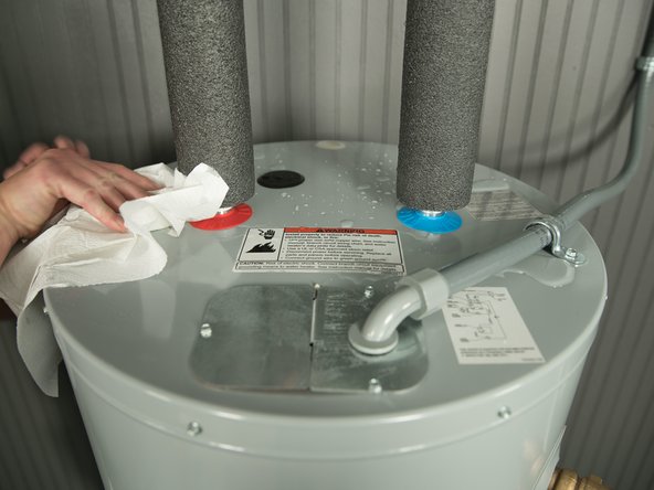 To more easily identify where a leak is coming from, dry up any drips using paper towels.