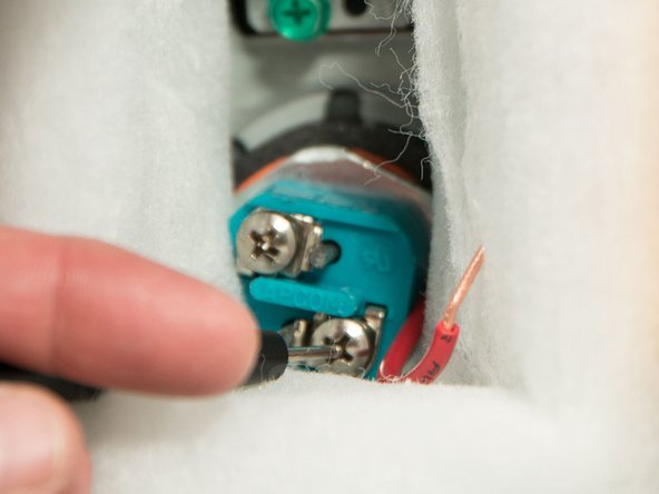 Check for a short between each heating element screw and the inner steel tank.