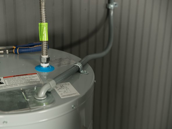 Use a UL listed or CSA approved strain relief to secure the electrical wiring to the water heater.