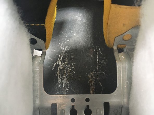 Press the metal mounting clip.