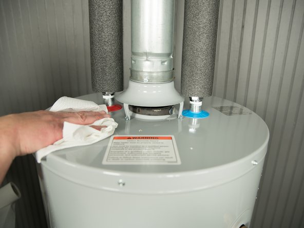 To more easily identify where a leak is coming from, dry up any drips using paper towels.