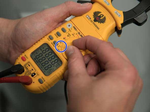 Set the multimeter to read AC Volts.