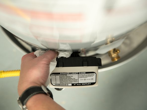 Use a dry paper towel to determine the source of the leak.