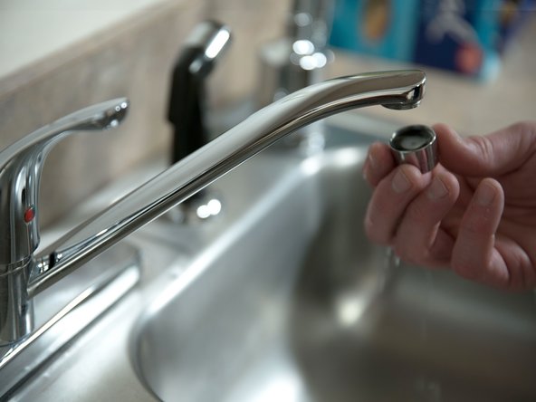 Remove the aerator at the nearest hot water faucet.  This allows any debris in plumbing system to be washed out of the pipes.