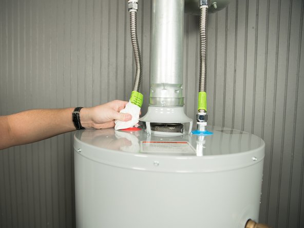 Using a fresh, dry paper towel, press the paper towel against the inlet and outlet connections and check for water droplets or moisture.