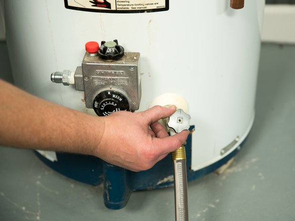 Opening a hot water faucet will help the water heater drain faster.