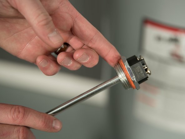 Lubricate the gasket of the new element with dish soap.