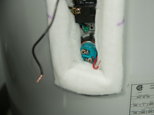 With the tank drained and power off, remove the power wires from  the element you intend to replace.