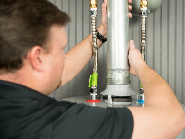 Secure the vent pipe to the draft hood with sheet metal screws.