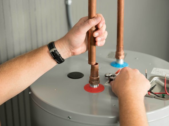Disconnect the cold and hot water pipes attached to the old water heater. Many are connected with  a threaded union that can be disconnected with wrenches.