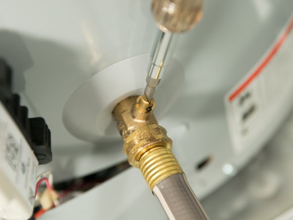 Opening a hot water faucet will help the water heater drain faster.