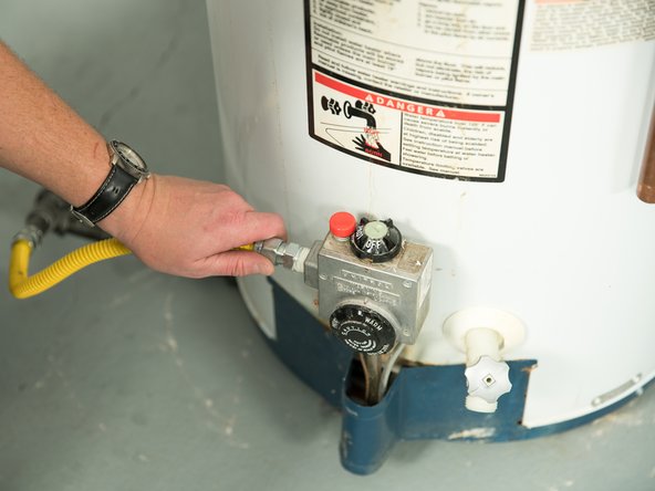 Disconnect the gas pipe from the old water heater's control valve.