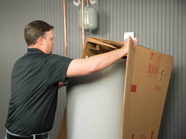 Cut the water heater box along the dotted lines.