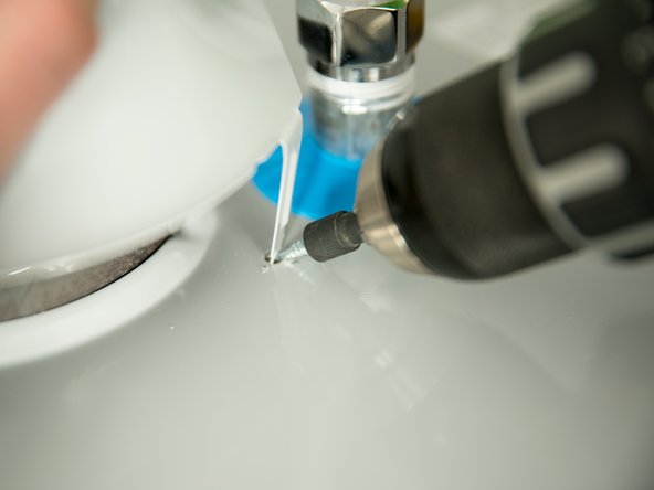 Secure the draft hood using the four screws provided.