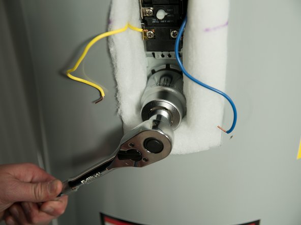 Tighten with an element wrench or 1 1/2&quot; deep well socket.