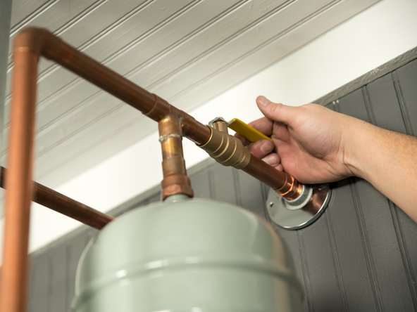 Once the tank has been drained, turn the cold water supply back ON and flush the tank until the water runs clear.