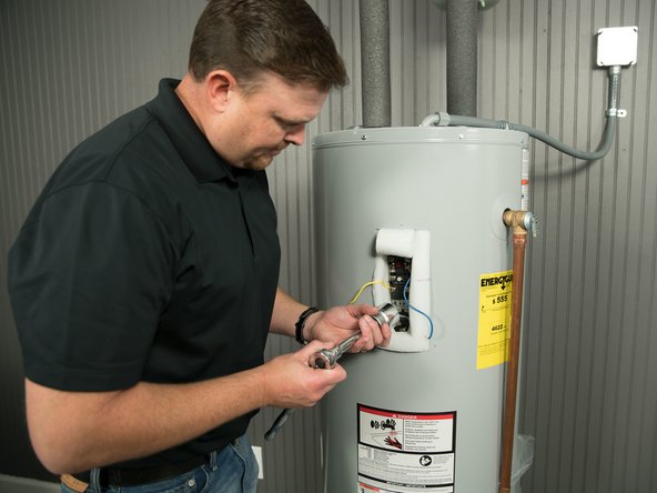 Unscrew the old element with an element wrench.