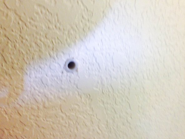 The wall anchors should fit very tightly in the holes.