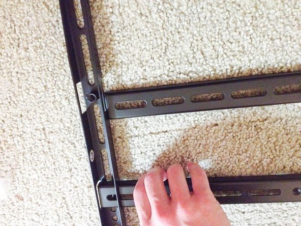 Slide the horizontal bracket lengths through the vertical bracket lengths.