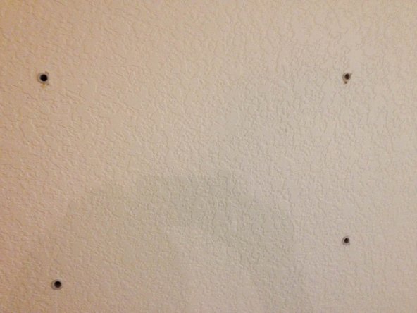 Secure the TV wall mount to the wall using 4 bolts.