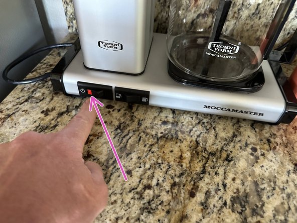 Turn on the coffee pot.