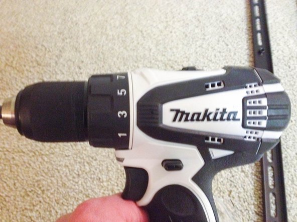 Depending on the size of bolts included with your kit, drill 4 holes in the locations you marked in the previous step.